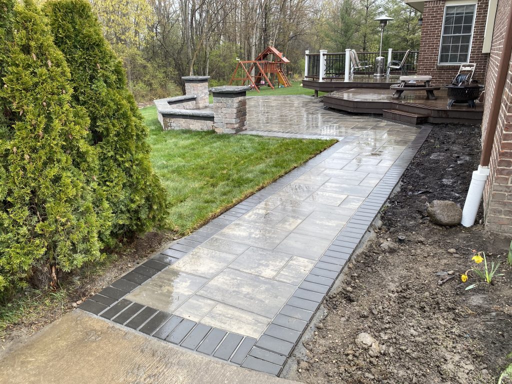 Stamped concrete walkway with brick pattern boosting curb appeal in Northville MI